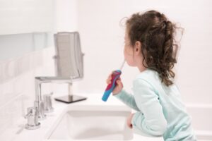 Child brushing teeth