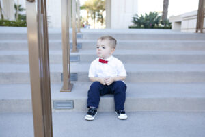 child sitting outside on steps