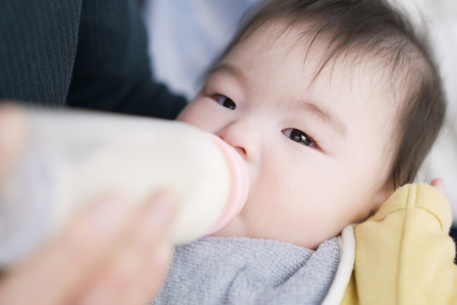 Baby drinking milk from a bottle