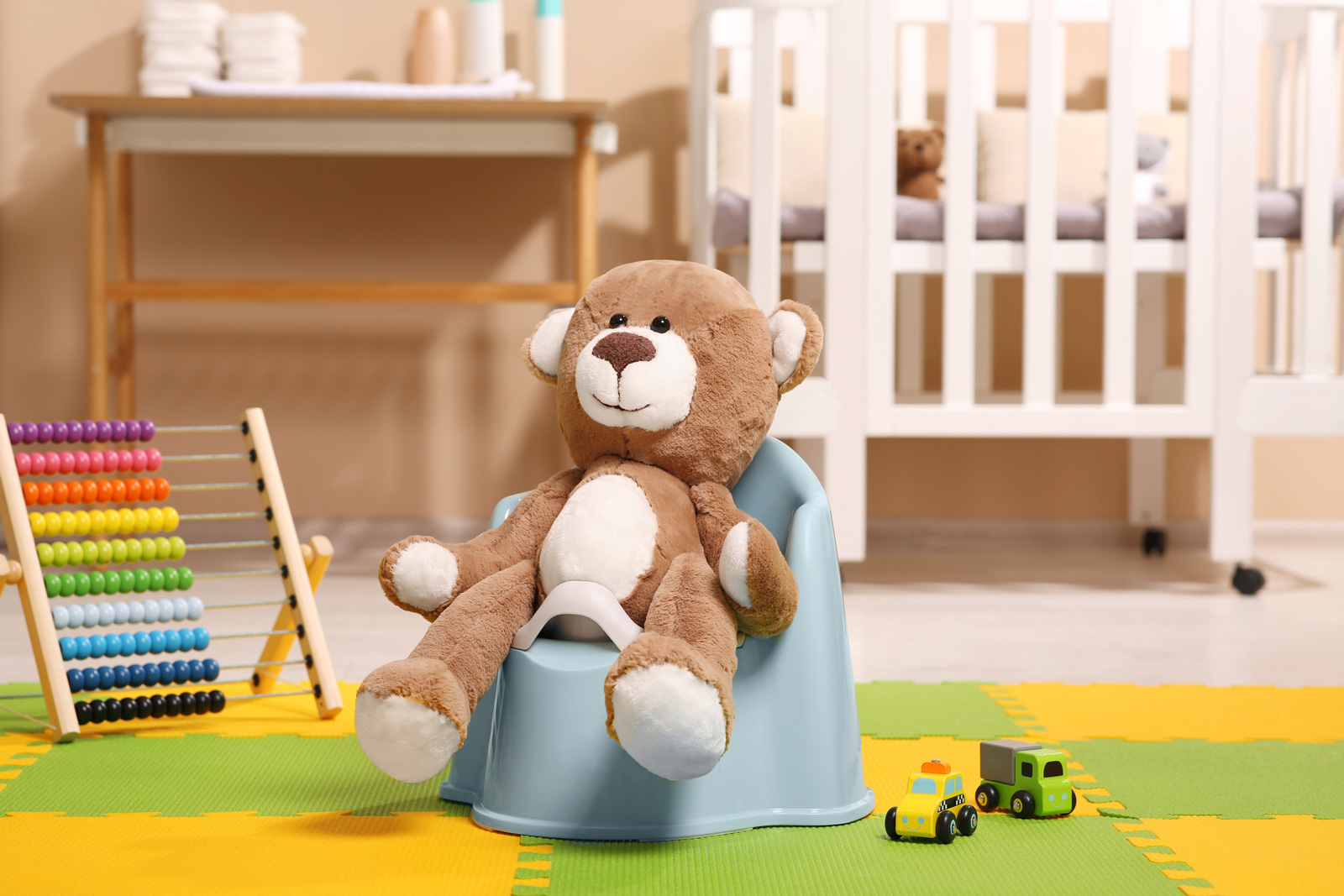 Potty training setup with stuffed bear