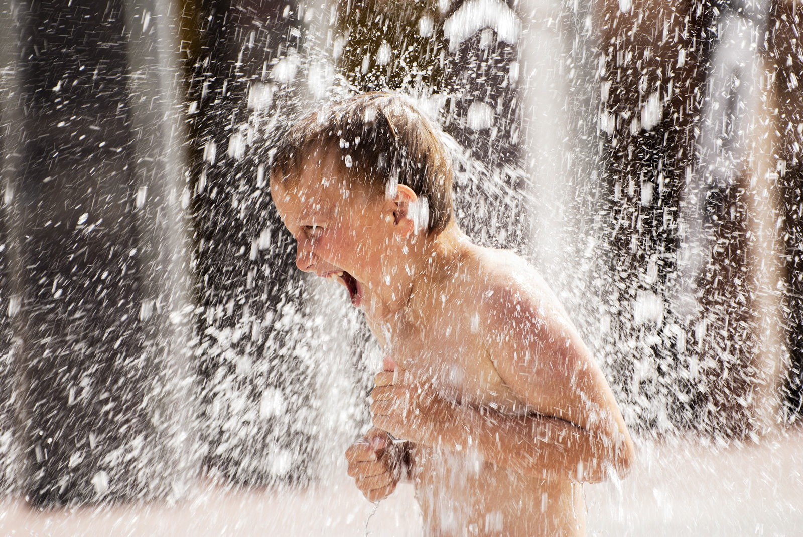 Boy plays in water