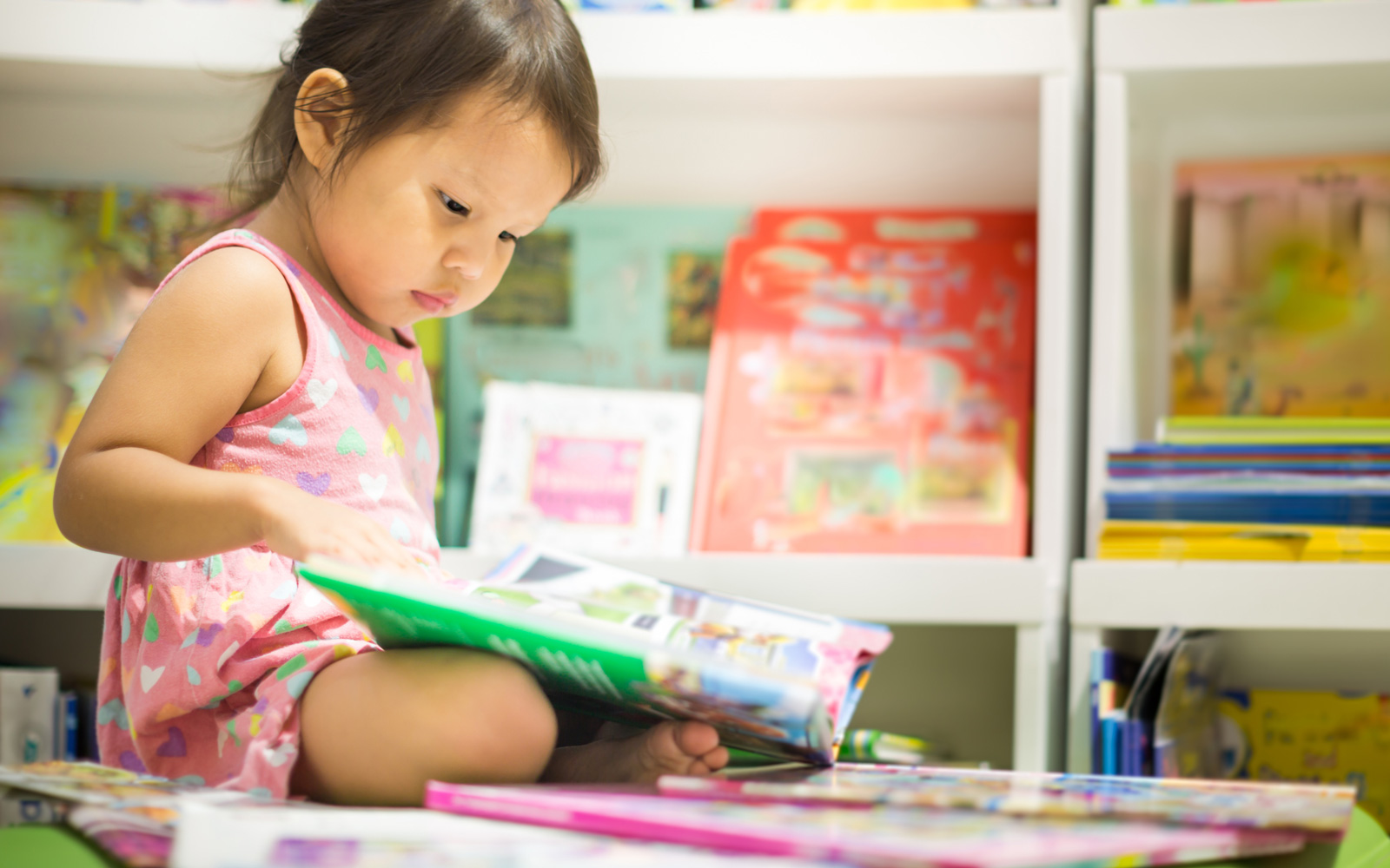 Toddler enjoying children's section at the library