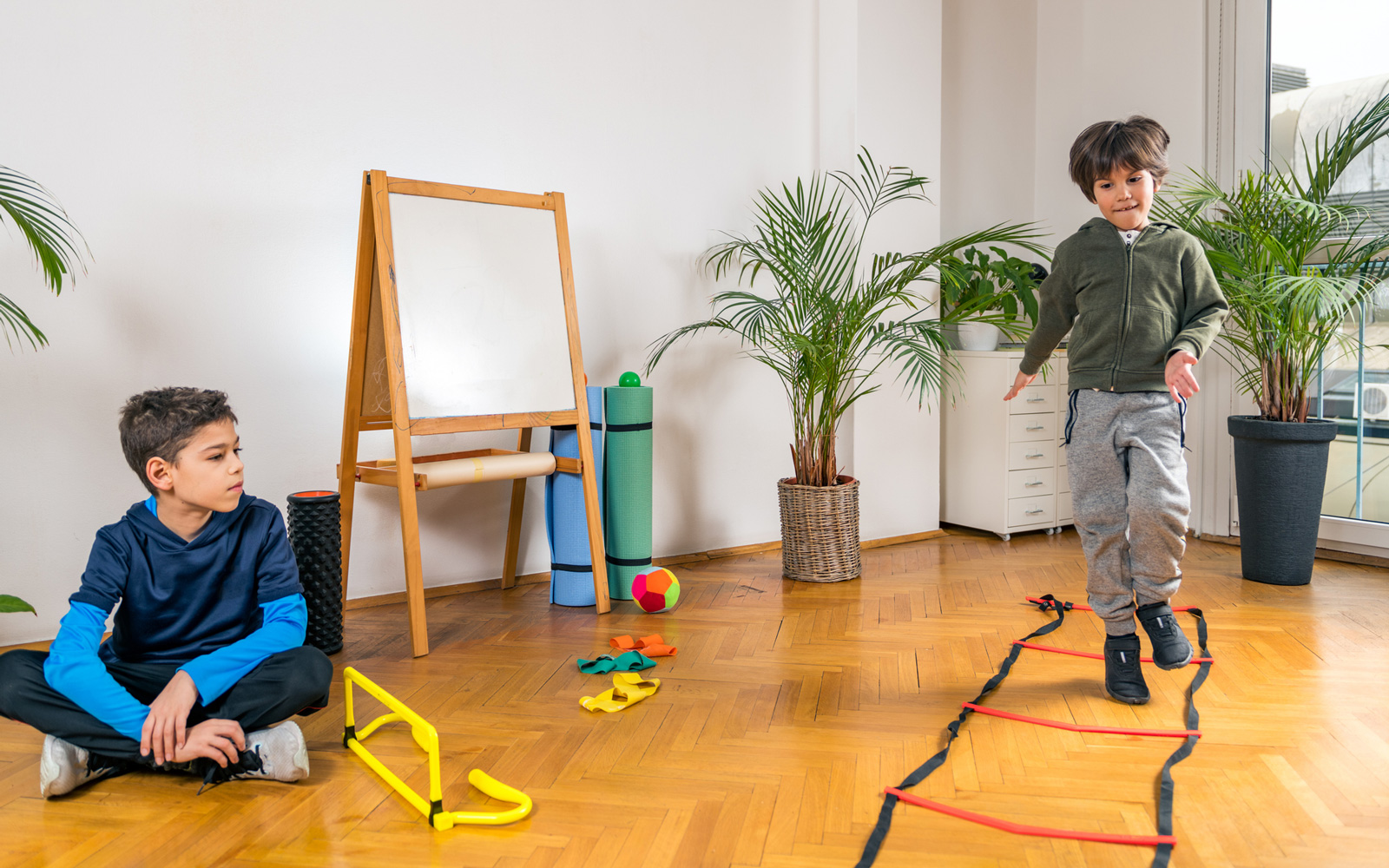 Kids play with an obstacle course at home