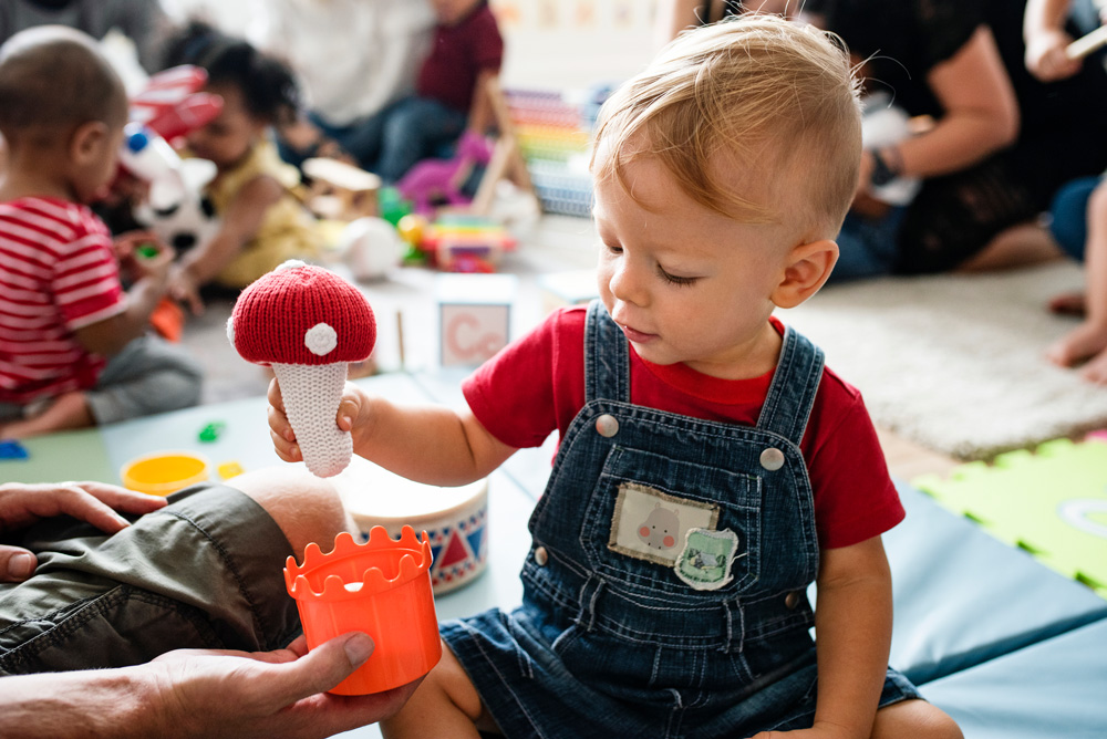 Little boy blows at daycare center