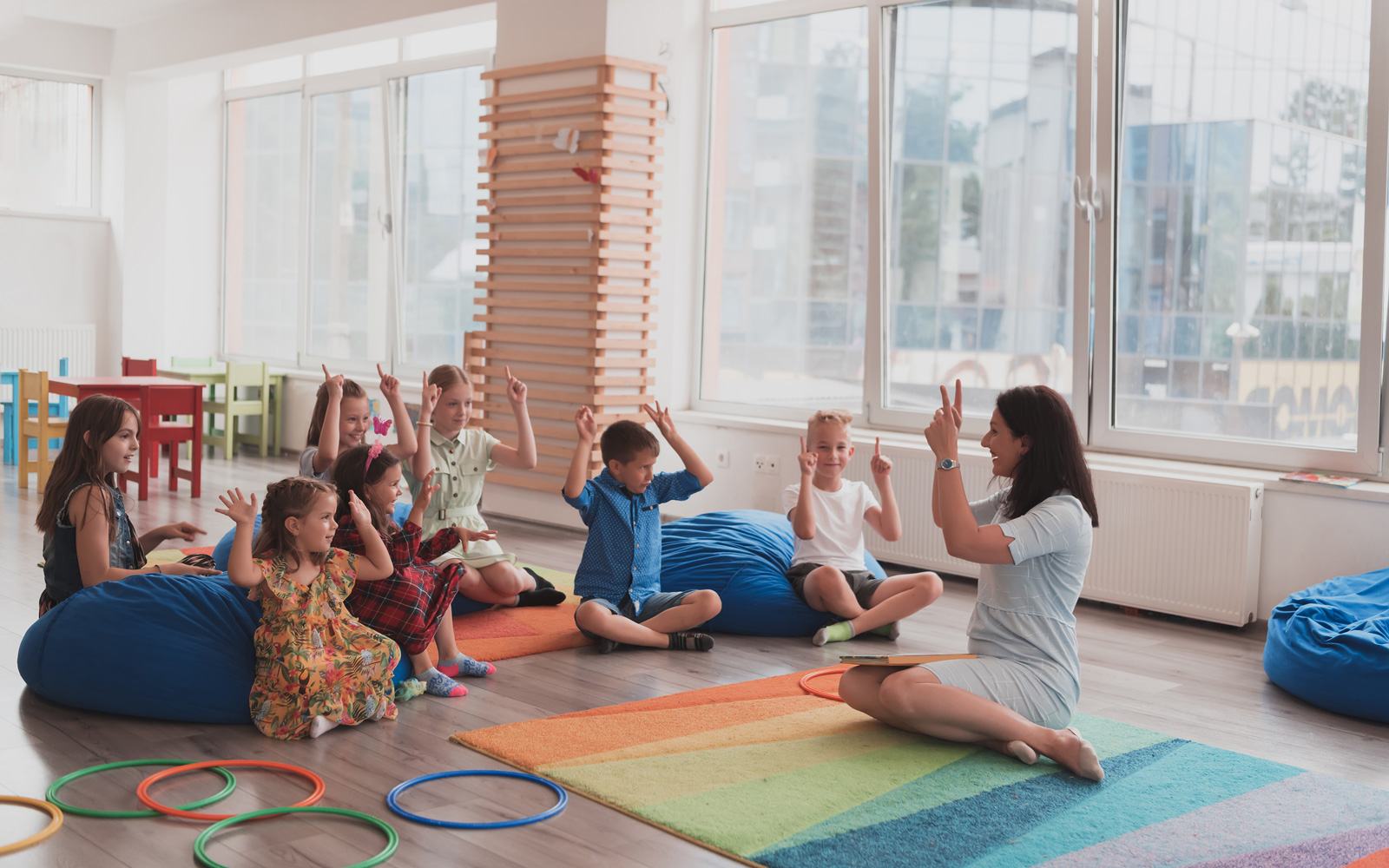 Teacher doing an activity with children at daycare center