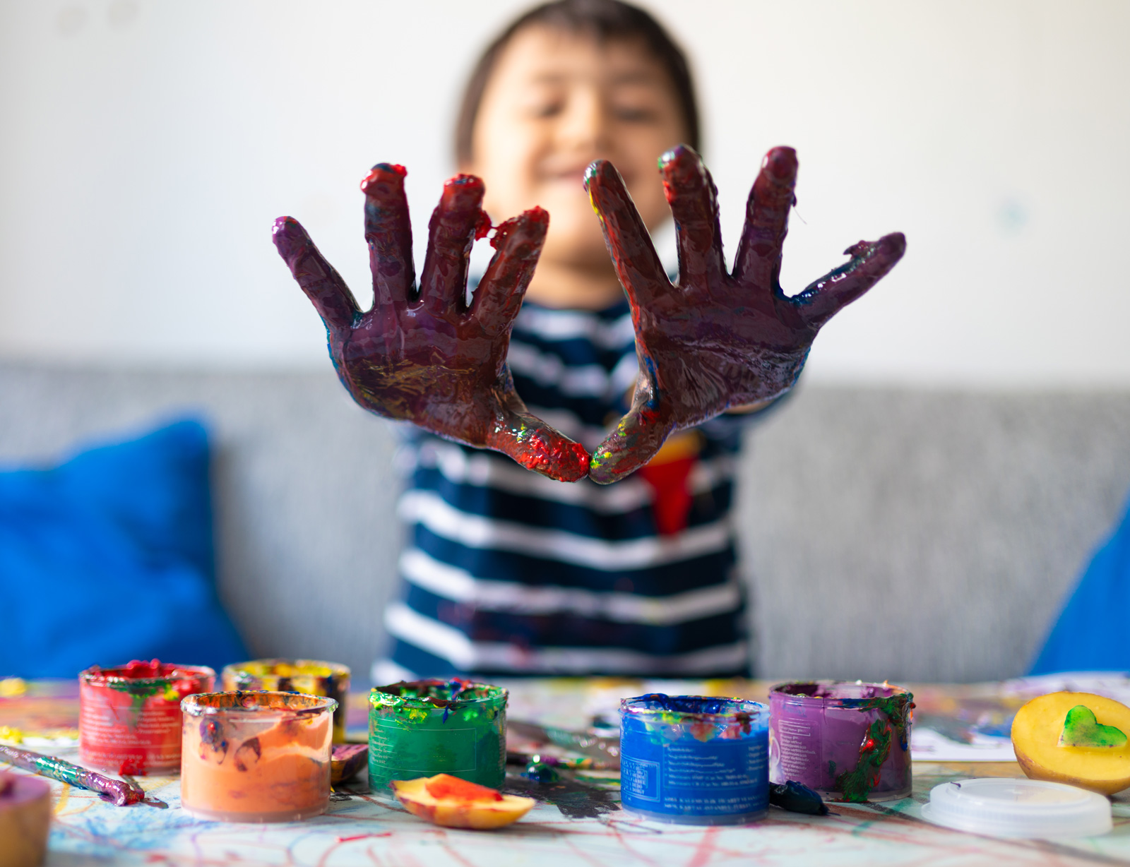 Toddler playing in paint